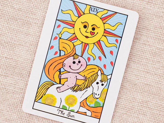 太陽と馬に乗った男の子の絵