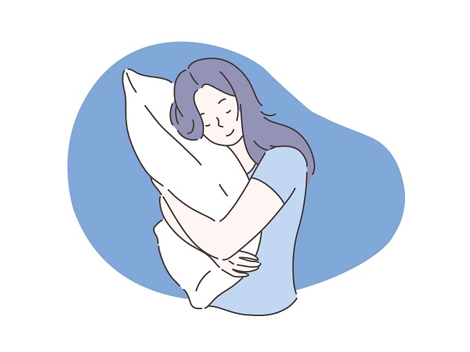 枕を抱えている女性のイラスト