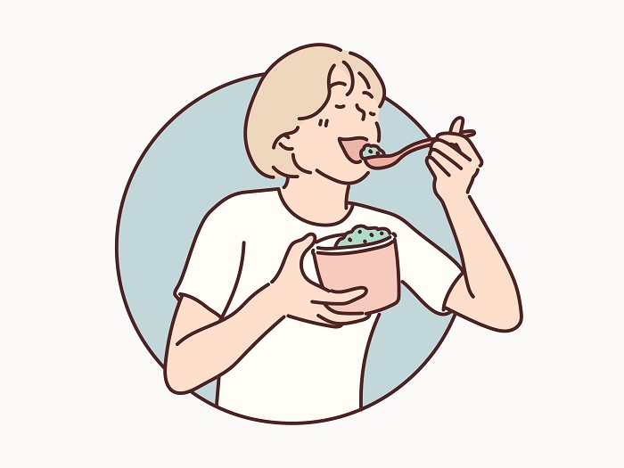 アイスを食べる女性のイラスト