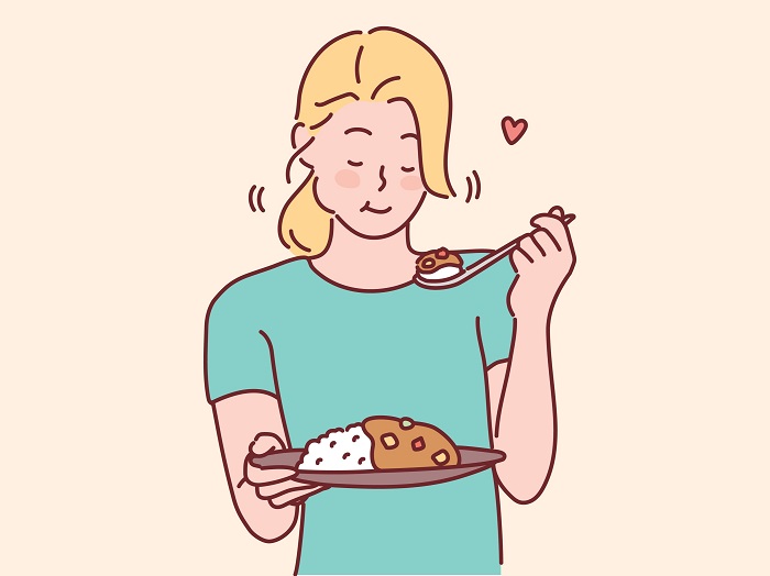 カレーを食べる女性のイラスト