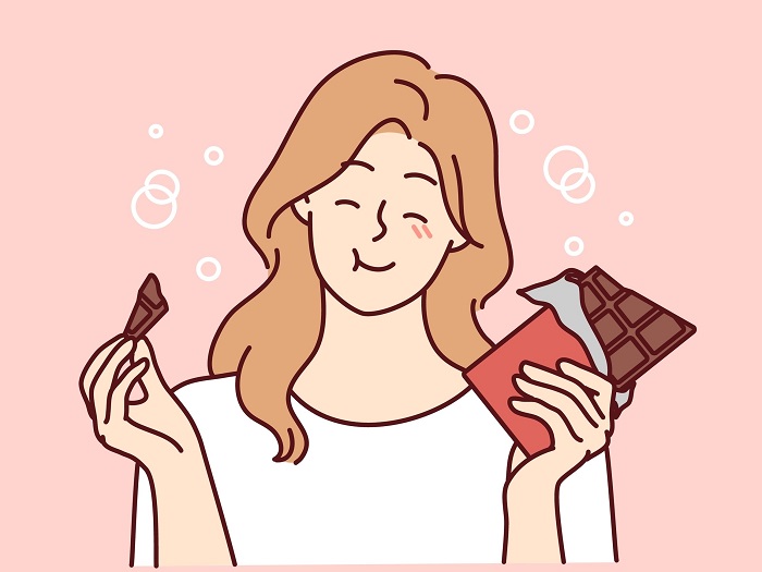 チョコレートを食べる女性のイラスト